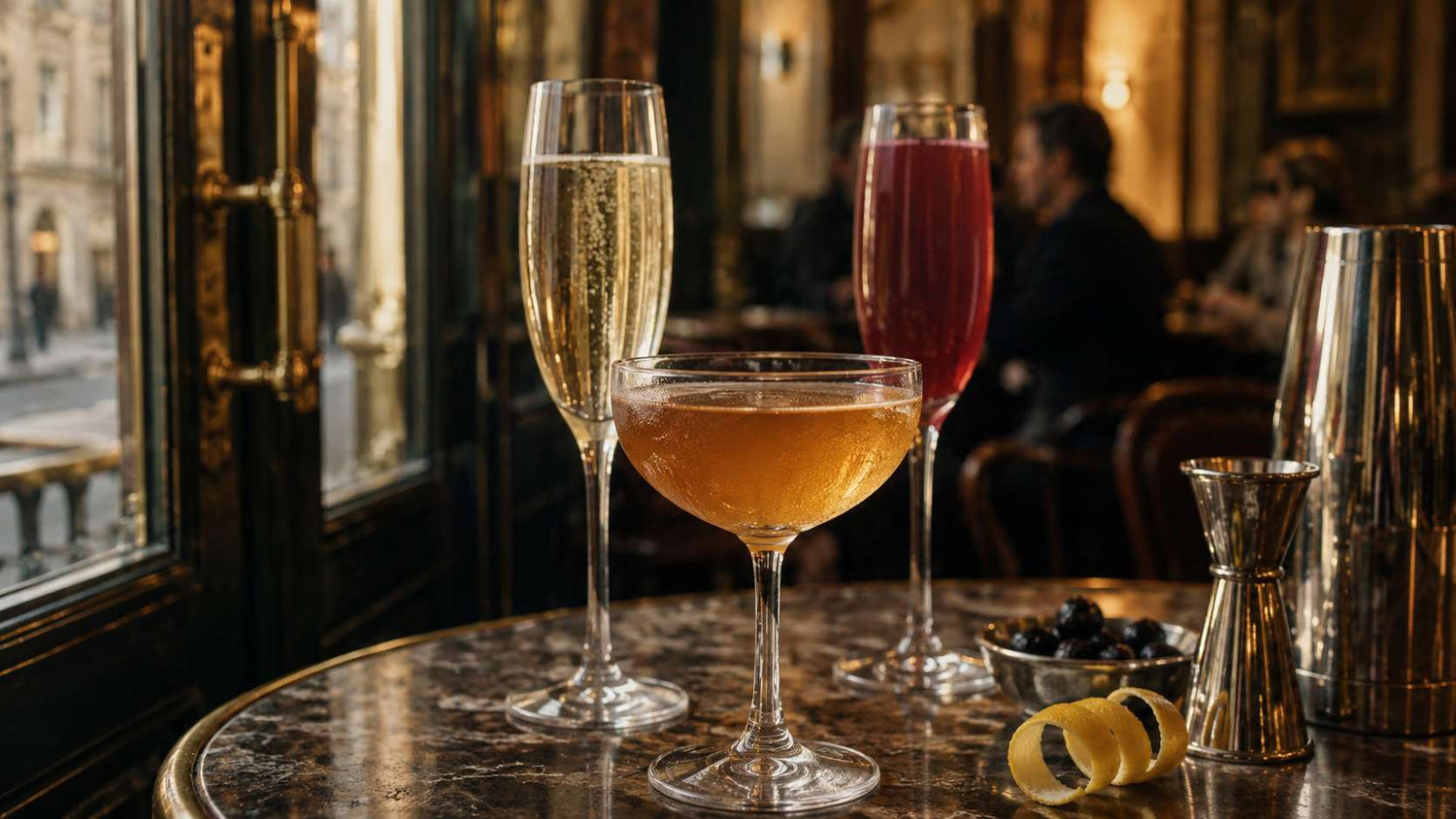 Classic French cocktails including a Sidecar, French 75, and Kir Royale in a Paris bar