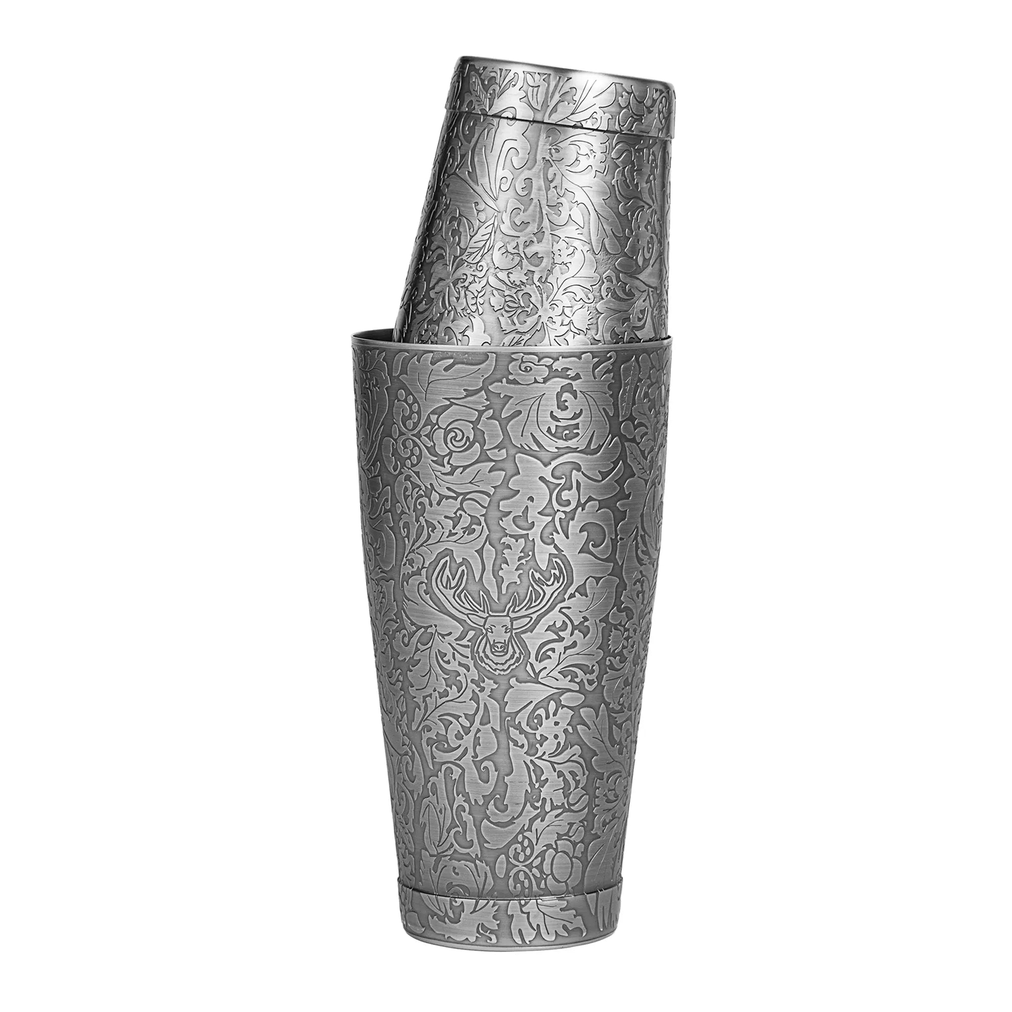 Decorative metal shaker with intricate patterns on a white background