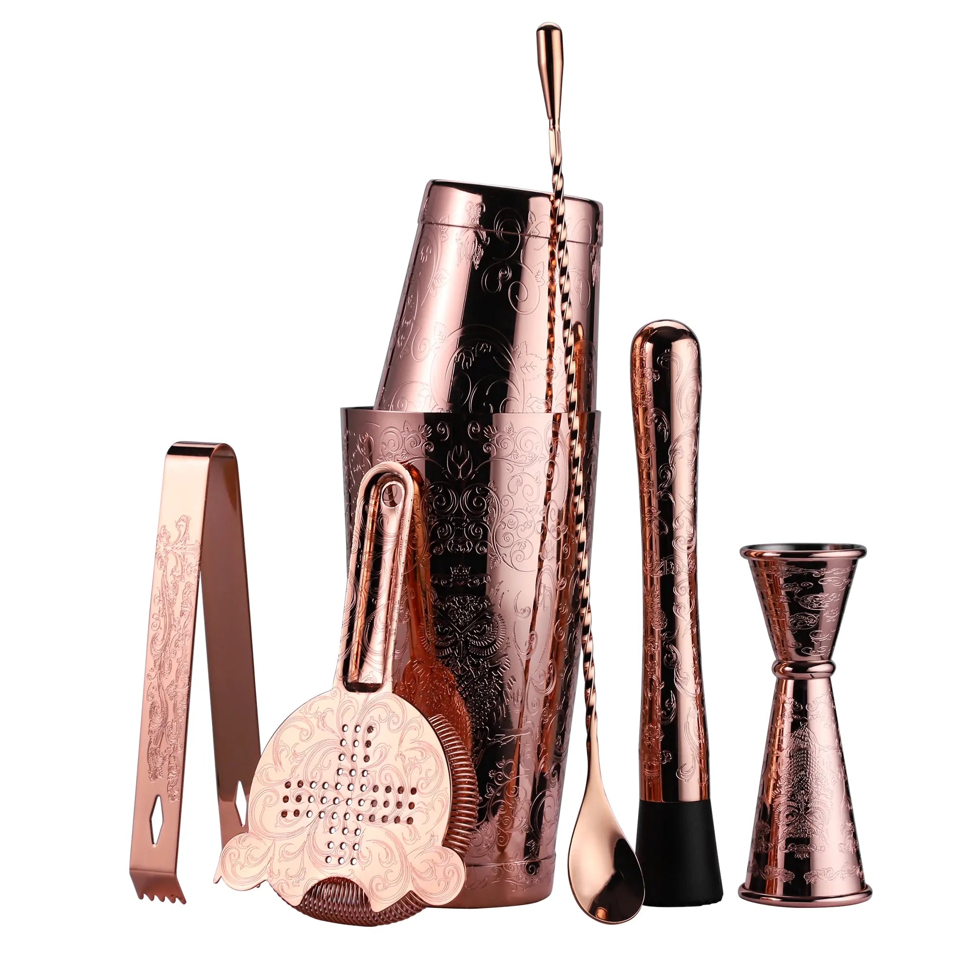 Set of rose gold cocktail tools including a shaker, jigger, and other utensils on a white background.