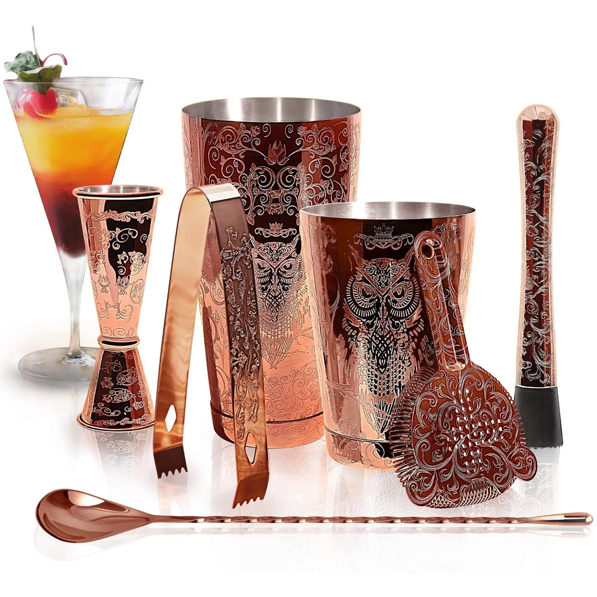 Copper barware set with intricate designs on a white background